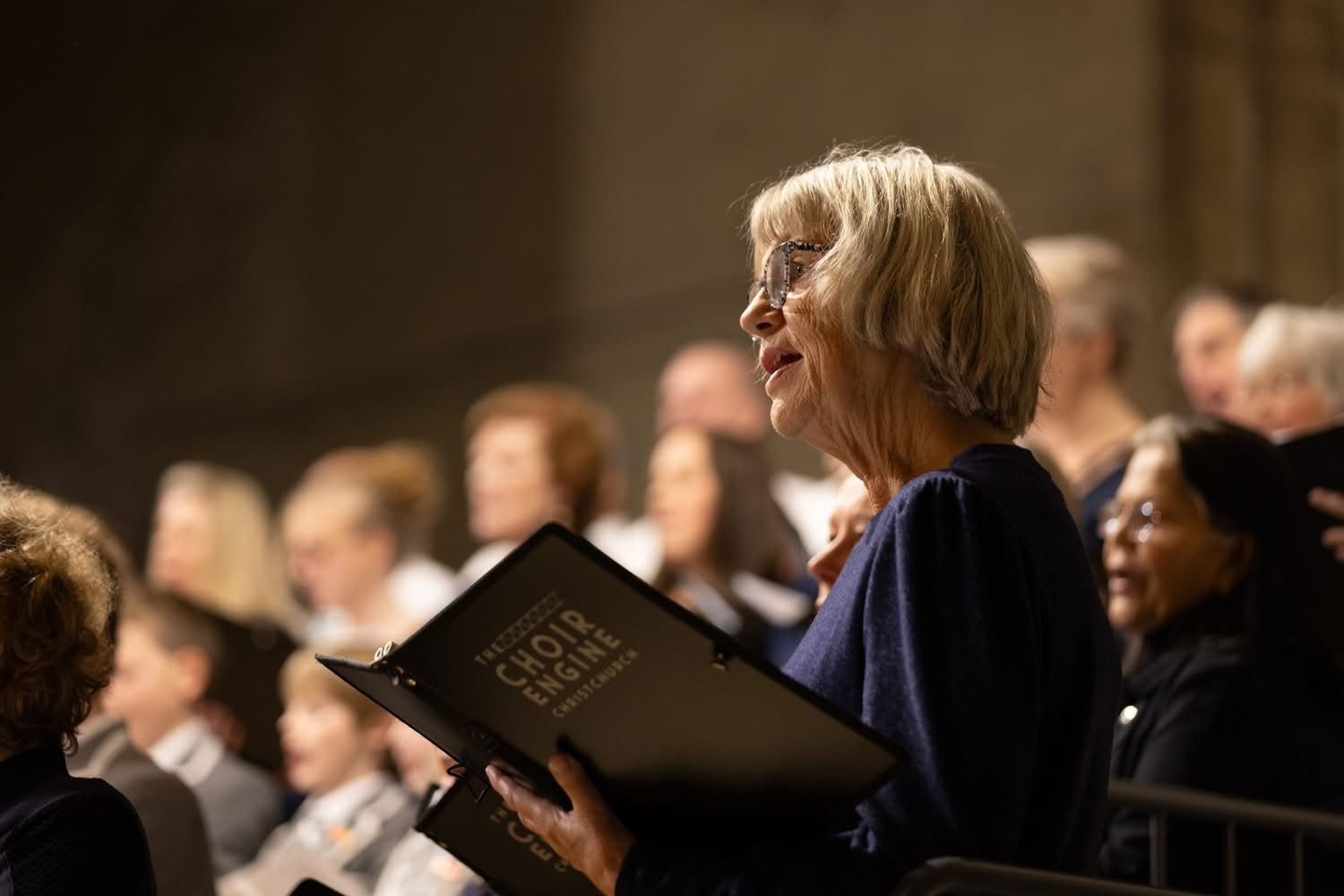 Caroline conducting the choir in performance