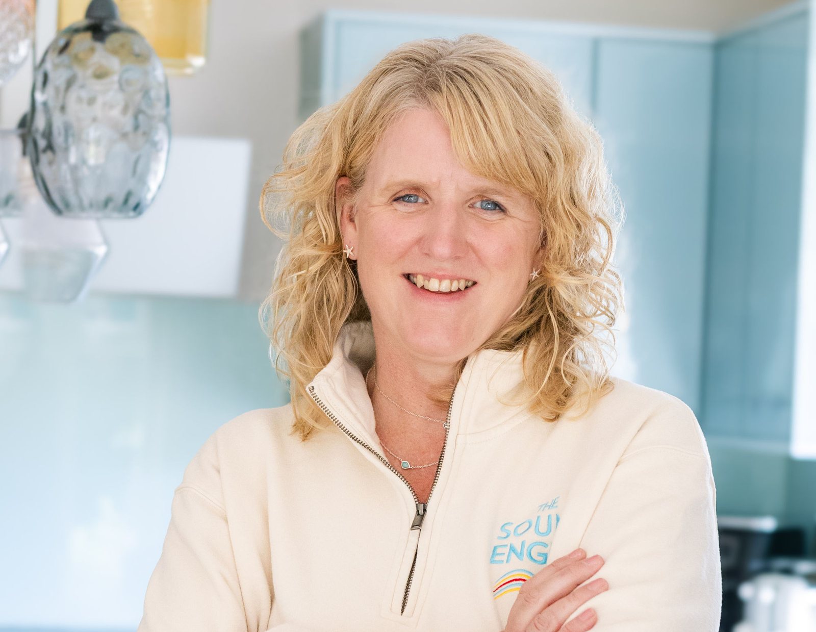 Caroline Moss smiling, wearing a Sound Engine polo shirt
