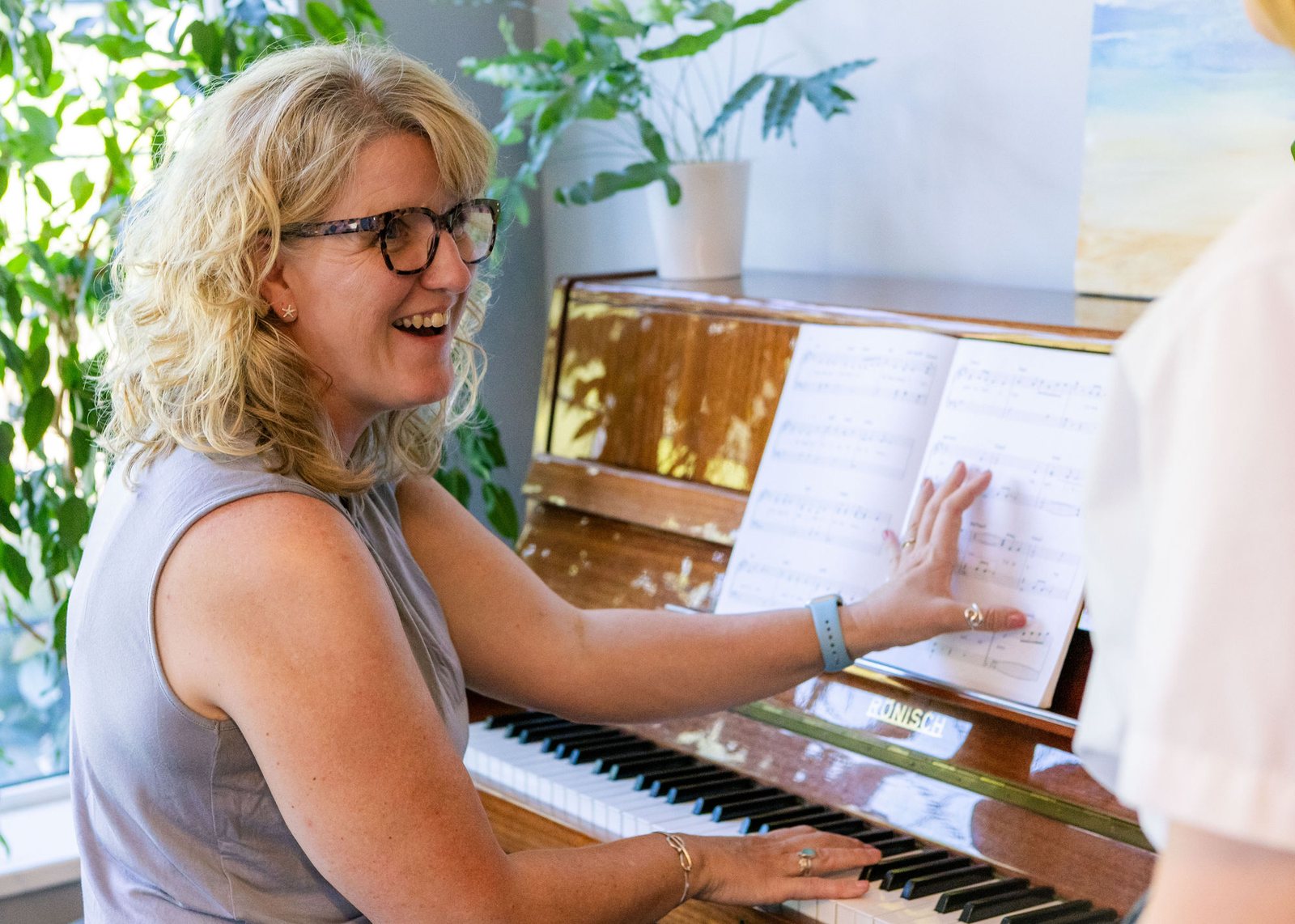 Caroline at the piano, mid-lesson
